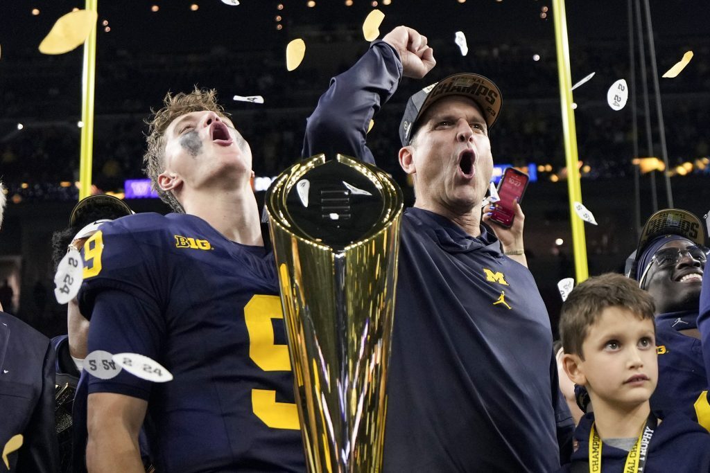 Jim Harbaugh and JJ McCarthy celebrate the Michigan Wolverines' CFB title win